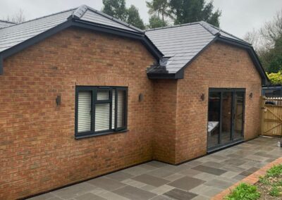 New extension with patio and walls